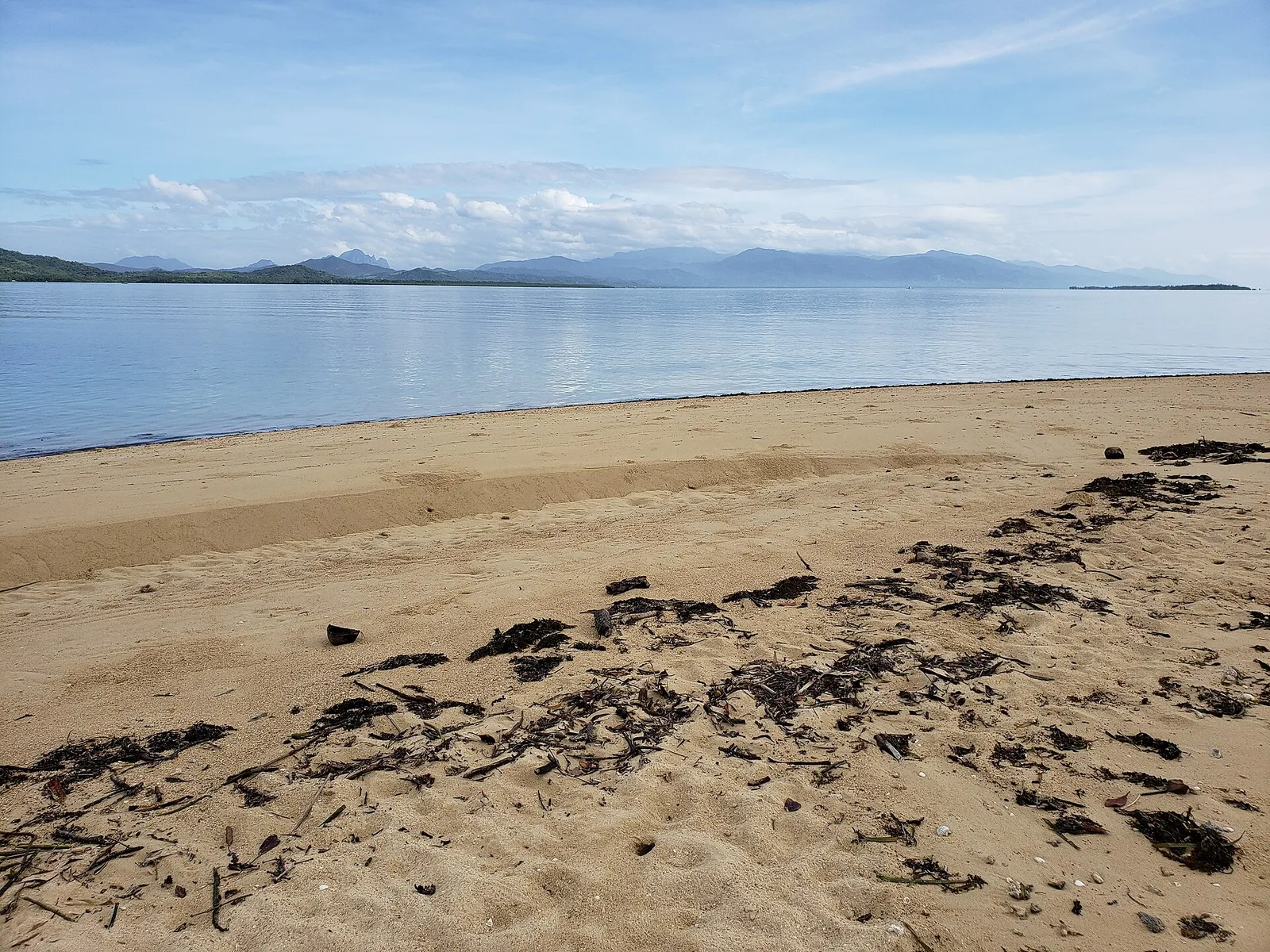 Clear shallow water over the reef at Honda Bay