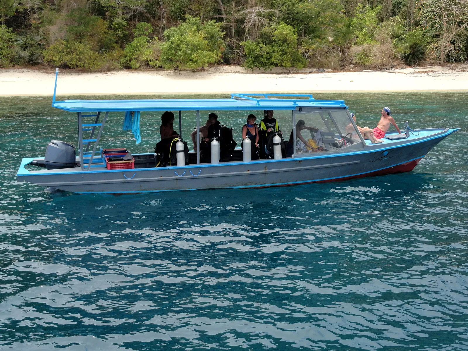 Dive boat anchored over a reef
